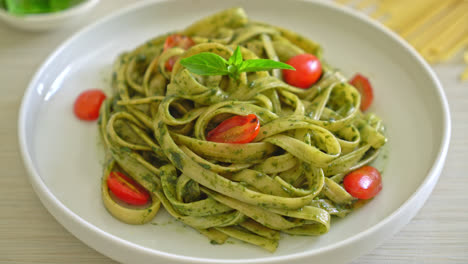 Fettuccine-spaghetti-pasta-with-pesto-sauce-and-tomatoes---vegan-and-vegetarian-food-style