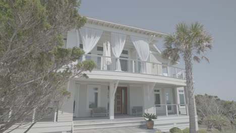 Beautiful-two-story-white-wood-cladded-seafront-property