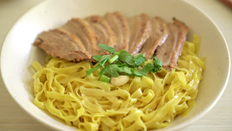 Dried-duck-noodles-in-white-bowl---Asian-food-style