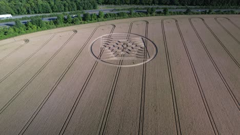Cinematic-footage-of-crop-circles-in-grain-crop-yellow-field-near-the-UK's-Micheldever-Station