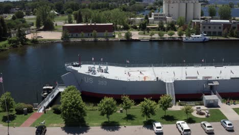 USS-LST-93-tank-landing-ship-in-Muskegon,-Michigan-with-drone-video-moving-sideways