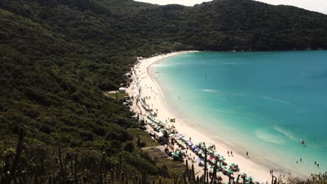 Aerial-view-of-idyllic-and-wild-Forno-beach-in-Arraial-do-Cabo,-RJ,-Brazil