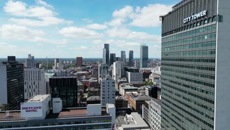 4K-30FPS-Aerial-drone-flight-in-Manchester-City-Centre-at-Piccadilly-Gardens-next-to-the-City-Tower-Building-overlooking-Deansgate-Towers-skyline-with-a-rooftops-view