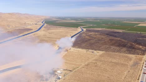 A-brush-fire-California’s-Central-Valley-as-the-dry-season-gets-longer-due-to-climate-change---aerial-parallax-view