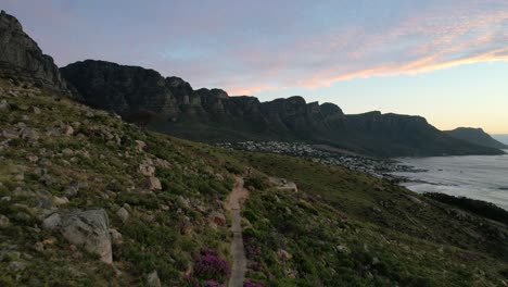 Parallax-aerial-of-Lions-Head-Trail-and-12-Apostles-in-Cape-Town-South-Africa-at-sunset