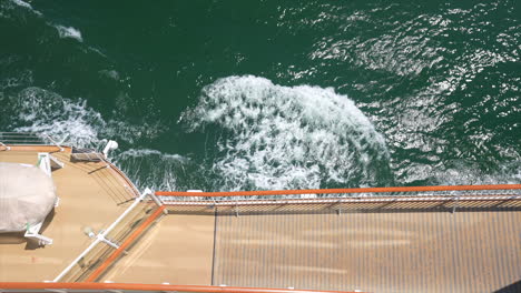 Boat-generating-waves-in-ocean-top-view-raft