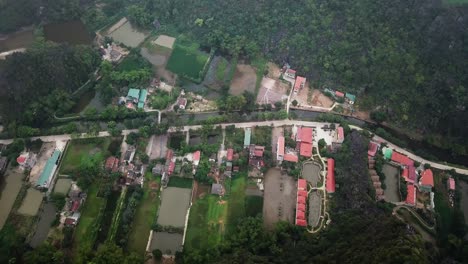 Flying-over-resorts-indicated-by-blue-swimming-pools-in-the-Tam-Coc-province