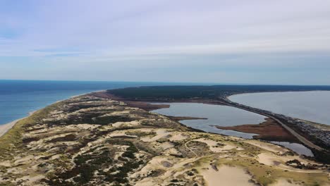 Flight-above-the-sand-dunes-of-the-the-causeway-towards-an-inlet-to-large-tidal