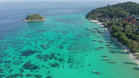 Aerial-of-longtail-boats-in-Koh-Lipe,-Thailand