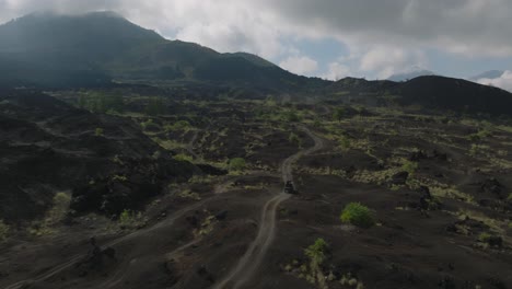 Old-dusty-lava-field-on-slope-of-Mount-Batur,-jeep-safari-tourist-attraction