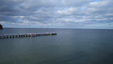 Aerial-drone-over-the-beautiful-baltic-sea,-the-Orlowo-Pier