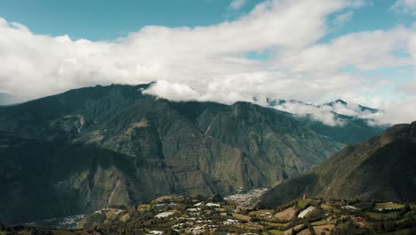 Runtun-Area-With-Tungurahua-Volcano-In-The-Background-In-Baños-de-Agua-Santa,-Ecuador---drone-shot