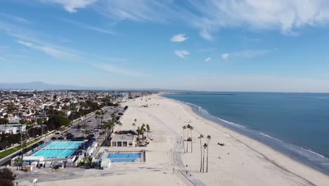 Drone-shot-over-beach-and-a-swimming-pool