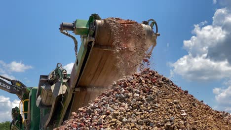 Crushed-rocks-and-concrete-coming-off-the-belt-of-a-rock-crusher-1