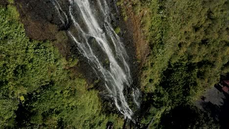 Water-Cascading-Down-Lush-Mountain,-Cascada-De-La-Virgen-In-Baños-De-Agua-Santa,-Ecuador---Drone-Shot
