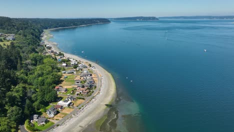 Aerial-view-of-the-shoreline-on-Whidbey-Island,-overlooking-the-vastness-of-the-Puget-Sound