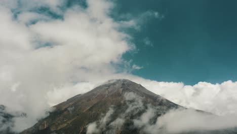 View-Of-Tungurahua-Stratovolcano-Covered-With-White-Clouds-In-Baños-de-Agua-Santa,-Ecuador---wide