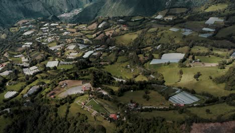 Aerial-Drone-View-Of-Andean-Highland-With-Baños-De-Agua-Santa-City-And-Tungurahua-Volcano-In-Ecuador