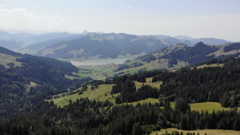 Aerial-panorama-on-serene-mountain-valley-and-Sihlseee-lake-in-Switzerland