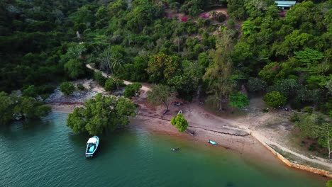 Dock-Boat-At-Kilifi-Bay-Reveals-Dense-Forest-In-Tropical-Mountains-In-Kenya-Coast,-Africa