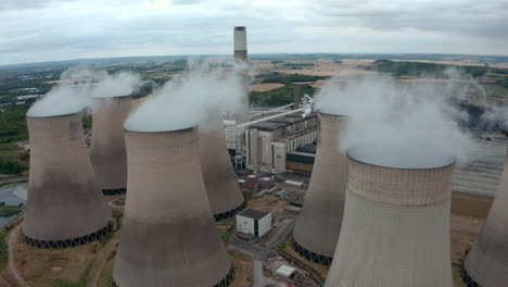 Establishing-drone-shot-of-coal-fired-power-plant-and-cooling-towers
