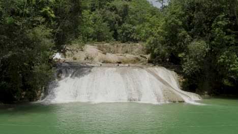 Aerial-is-flying-around-a-Waterfall-at-Roberto-Barrio,-Palenque,-Chiapas,-Mexico