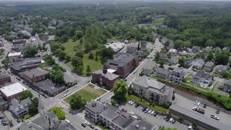Aerial-view-overlooking-the-town-of-Plymouth,-USA---ascending,-tilt,-drone-shot