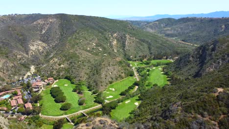 Aerial,-overlooking-The-Ranch,-golf-course-and-canyons-at-Laguna-Beach-in-Los-Angeles,-California