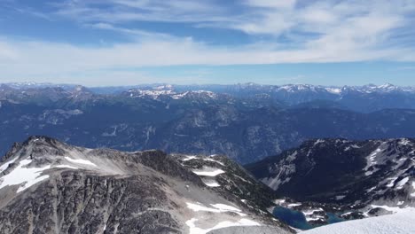 Mountain-Landscape-Aerial-Drone-of-Pacific-Ranges-with-Snow-in-Foreground-Canada-4K