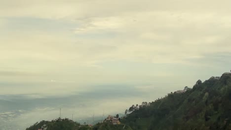 Cloudscape-Panning-Shot-Overlooking-the-Landscape-of-Kasauli-in-India