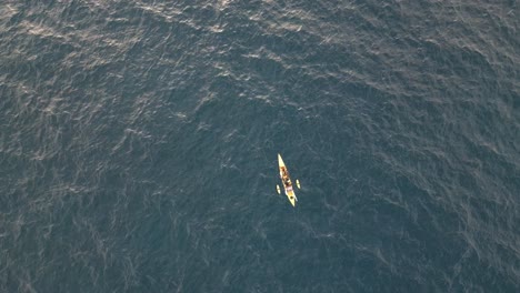 Yellow-kayak-is-fihing-at-the-middle-of-the-ocean