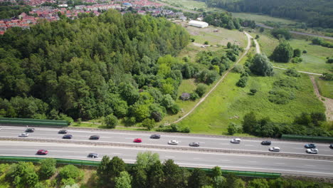 Several-Cars-Driving-On-Four-Lane-Road-During-Daytime-In-Gdynia,-Northern-Poland