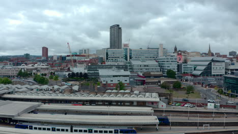 Smooth-establishing-drone-shot-low-angle-of-Sheffield-city-from-the-train-station