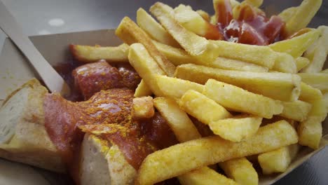 Famous-Street-Food-in-Berlin-the-Curried-Sausage-with-Fries-and-Sauce