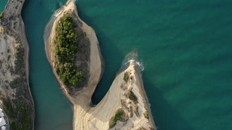 Aerial-top-down-shot-of-the-Canal-D'Amour-small-beach-in-Sidari-Corfu-island,-Greece