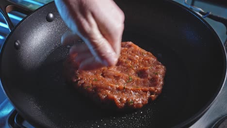 Hand-Pressing-Juicy-Patty-In-Hot-Pan-With-Cooking-Oil