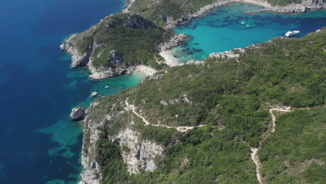 Aerial-approach-shot-of-the-famous-Porto-Timoni-double-beaches-in-Corfu-island,-Greece