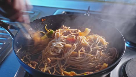 Stirring-Chow-Mein-Noodles-With-Ground-Turkey-And-Vegetables-Cooked-In-A-Skillet