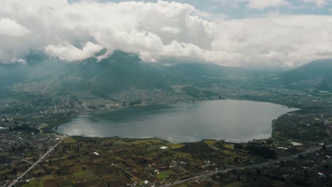 Panoramic-View-Over-San-Pablo-Lake-And-Imbabura-Inactive-Stratovolcano-In-Ecuador---drone-shot