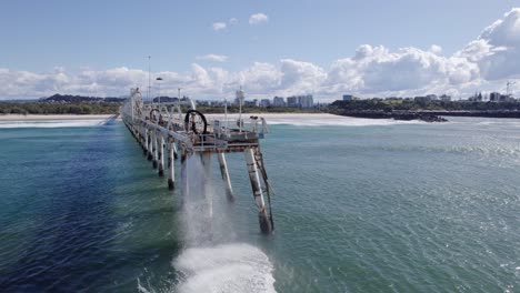 Sand-water-Mixture-Being-Pumped-Out-From-Tweed-River-Entrance-Through-Sand-Bypassing-Facility-On-TSB-Jetty-In-Australia