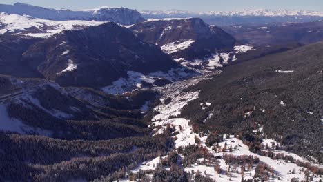Val-Gardena-valley-during-winter-time-in-Italian-Dolomites-Alps,-aerial