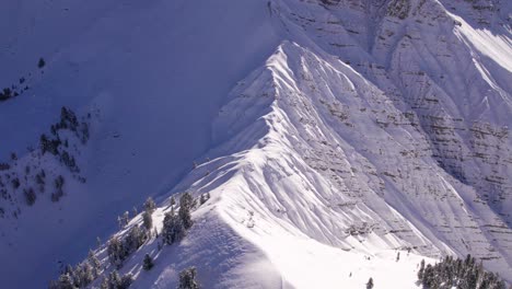 Seceda-mountain-face-wall-during-winter,-aerial