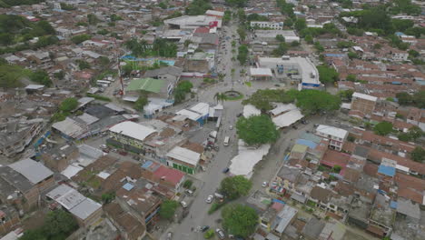 Wide-aerial-footage-that-is-rotating-of-a-roundabout-in-Jamundí,-Colombia