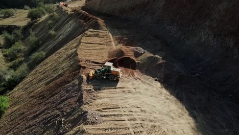 Natural-gas-pipeline-construction-in-the-mountains,-bulldozer-and-excavator-working