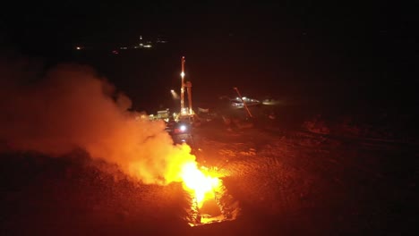 Aerial-view-of-natural-gas-field-exploration-in-the-desert-night-scene-gas-flames