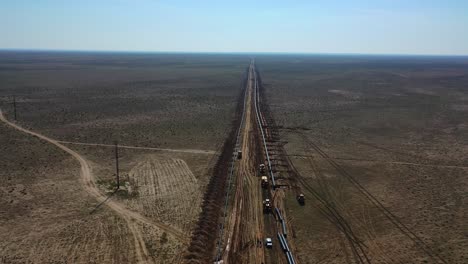Aerial-view-of-construction-of-natural-gas-and-oil-pipeline-in-the-desert