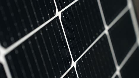 Macro-detail-closeup-of-black-high-efficiency-Solar-Panelcells,-rising-tilt