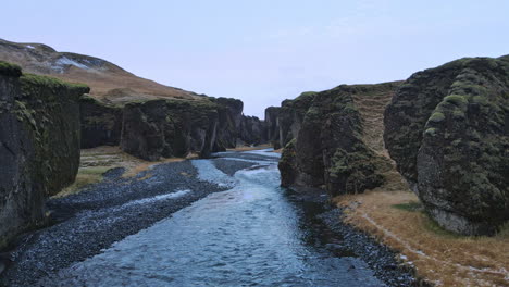 Entering-Fjadrargljufur-canyon-aerial-shot-in-Iceland-in-early-winter