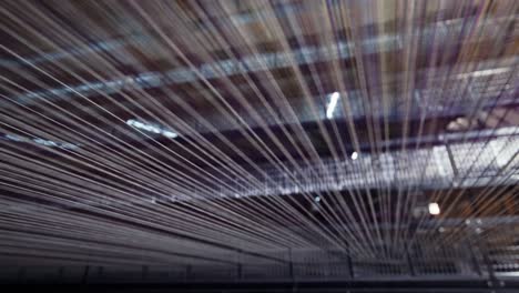 Yarn-thread-lines-on-the-weaving-loom-machine-in-textile-factory-1