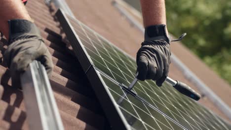 Close-up-of-PV-professional-installing-new-high-end-black-Solar-Panel,-day